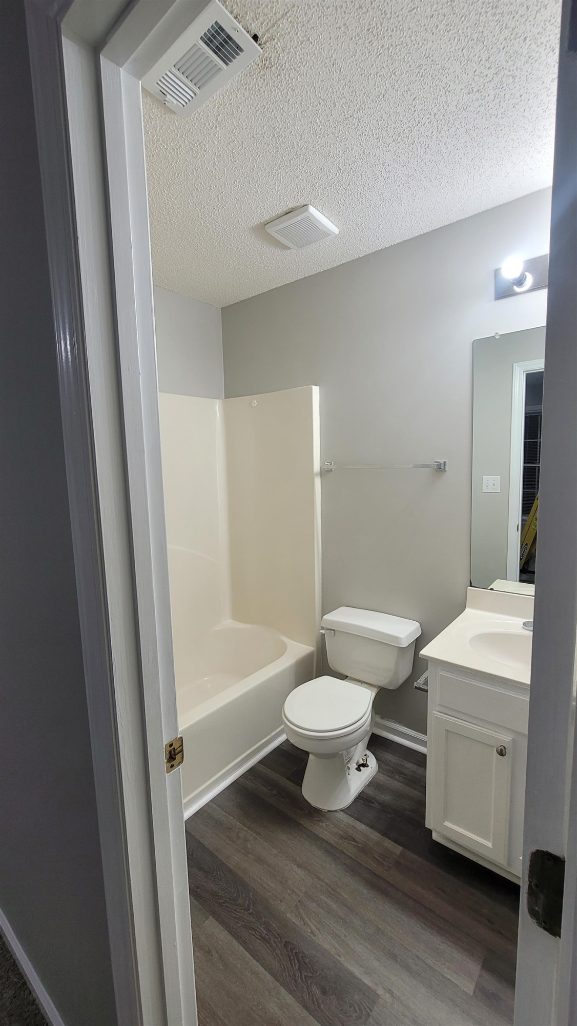 3809 Axle Lane Raleigh, NC 27616 - Photo 13 of 30 a bathroom with a sink toilet a mirror and shower
