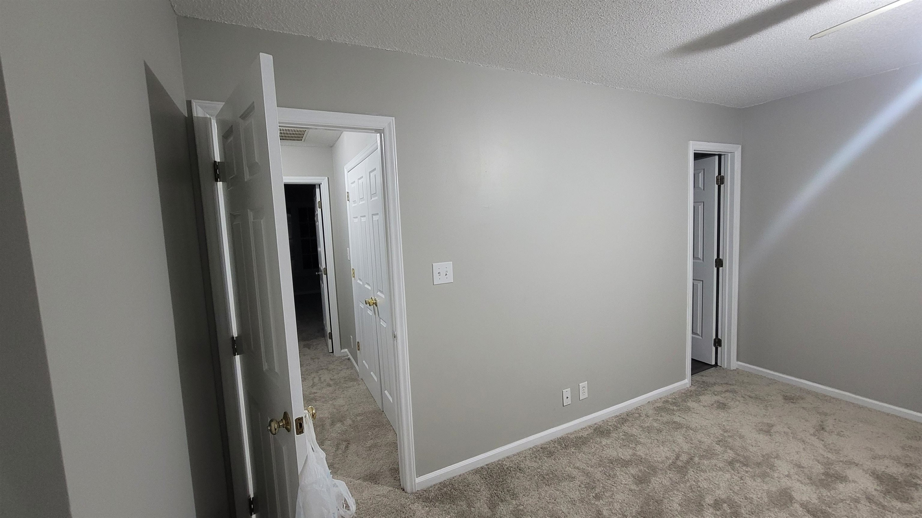 3809 Axle Lane Raleigh, NC 27616 - Photo 14 of 30 an empty room with wooden floor and mirror