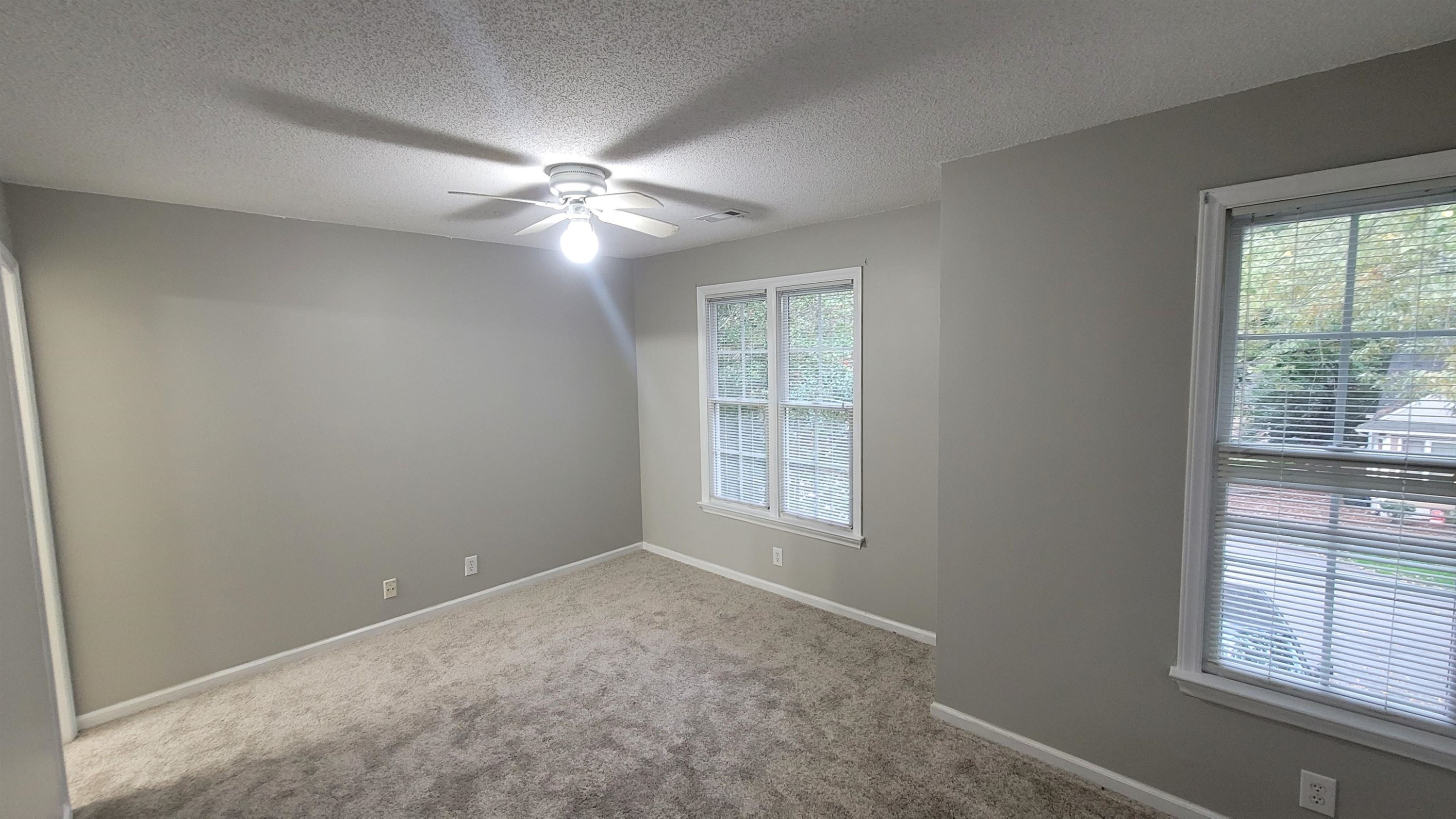 3809 Axle Lane Raleigh, NC 27616 - Photo 17 of 30 an empty room with windows and fan