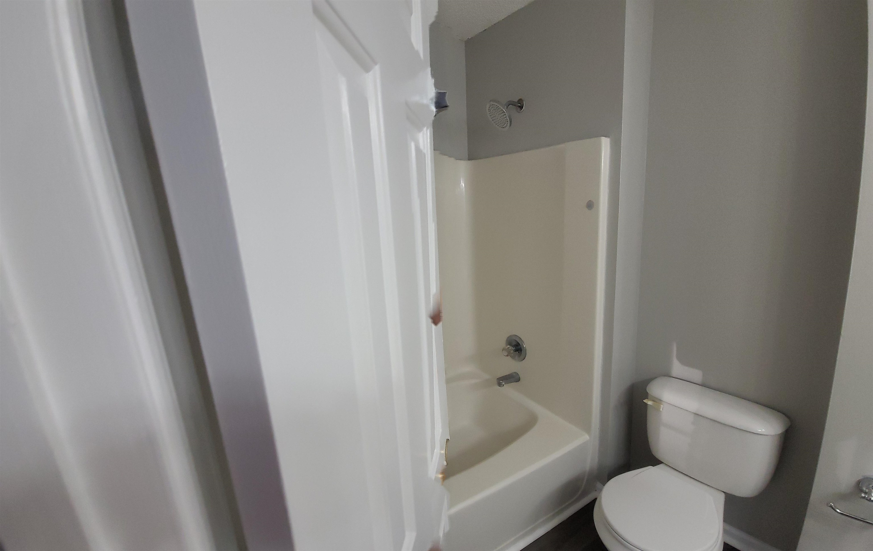 3809 Axle Lane Raleigh, NC 27616 - Photo 23 of 30 a bathroom with a toilet and a shower