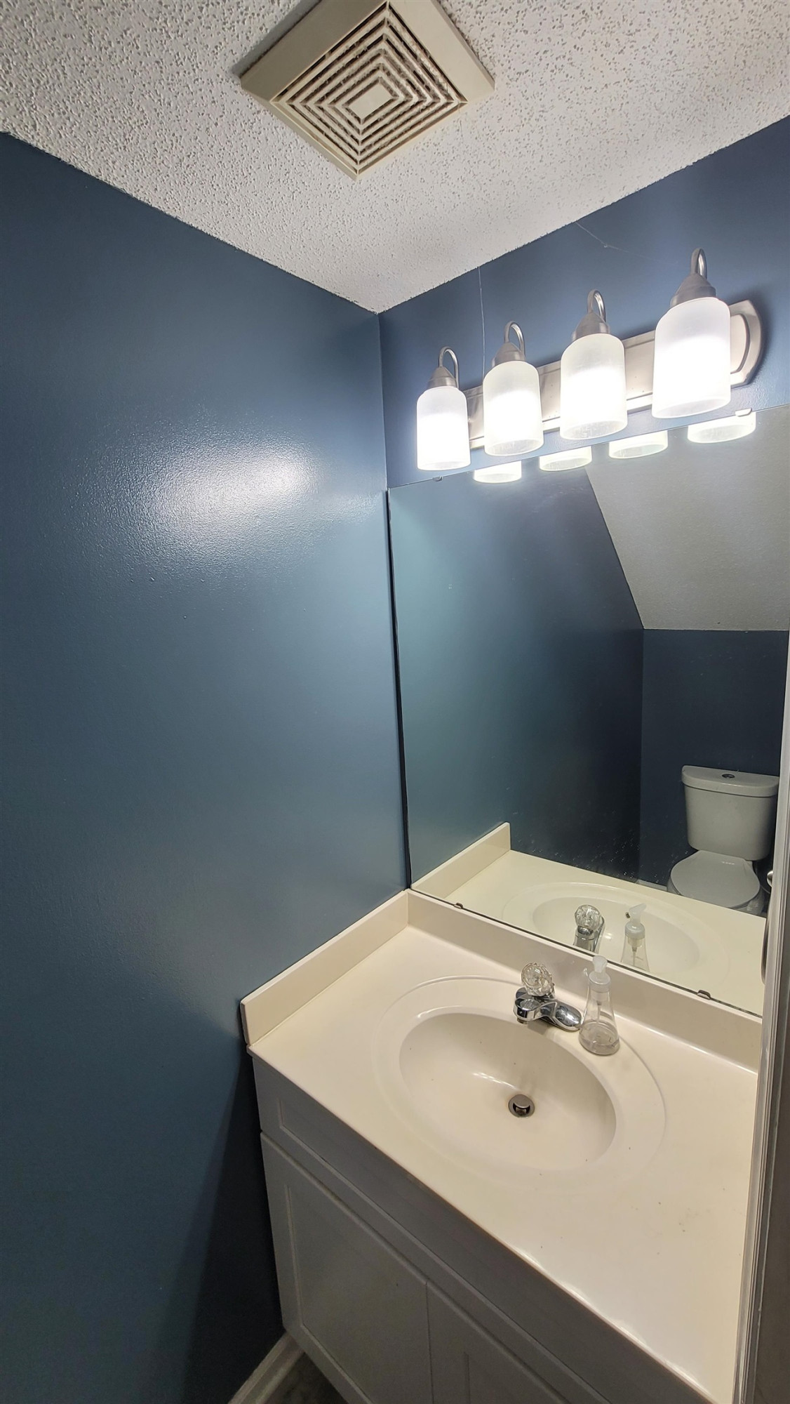 3809 Axle Lane Raleigh, NC 27616 - Photo 27 of 30 a bathroom with a sink and a mirror