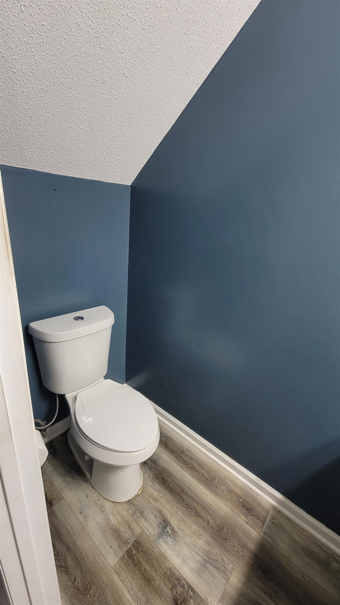 3809 Axle Lane Raleigh, NC 27616 - Photo 28 of 30 a white toilet sitting next to a small bathroom