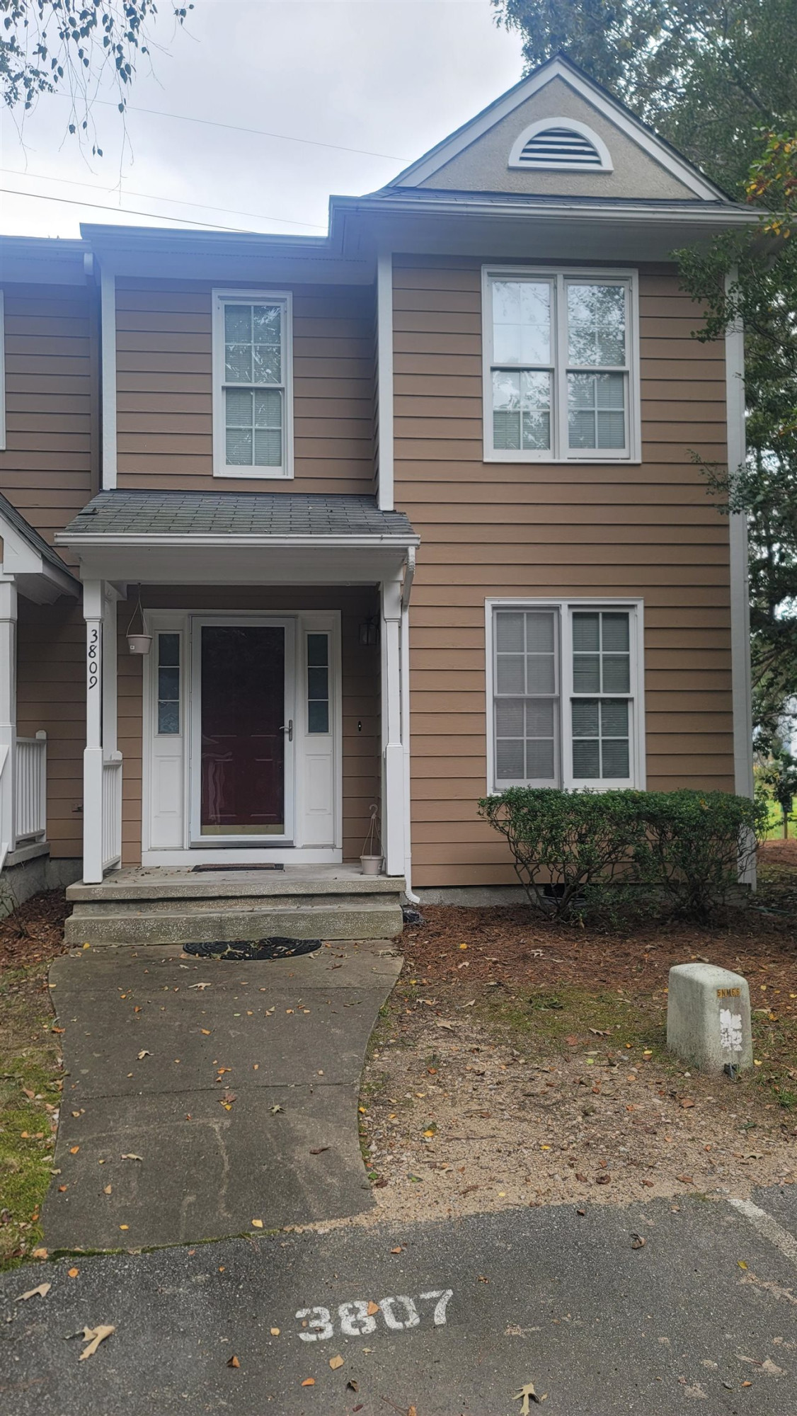 3809 Axle Lane Raleigh, NC 27616 - Photo 3 of 30 a front view of a house with a garden