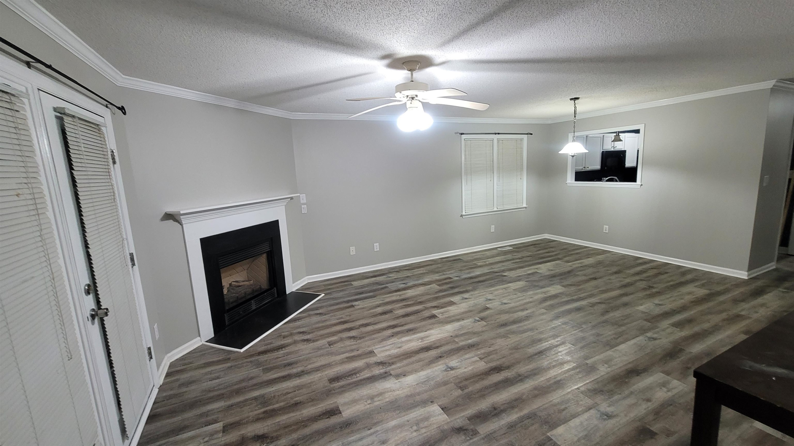 3809 Axle Lane Raleigh, NC 27616 - Photo 8 of 30 a view of empty room with wooden floor and fireplace