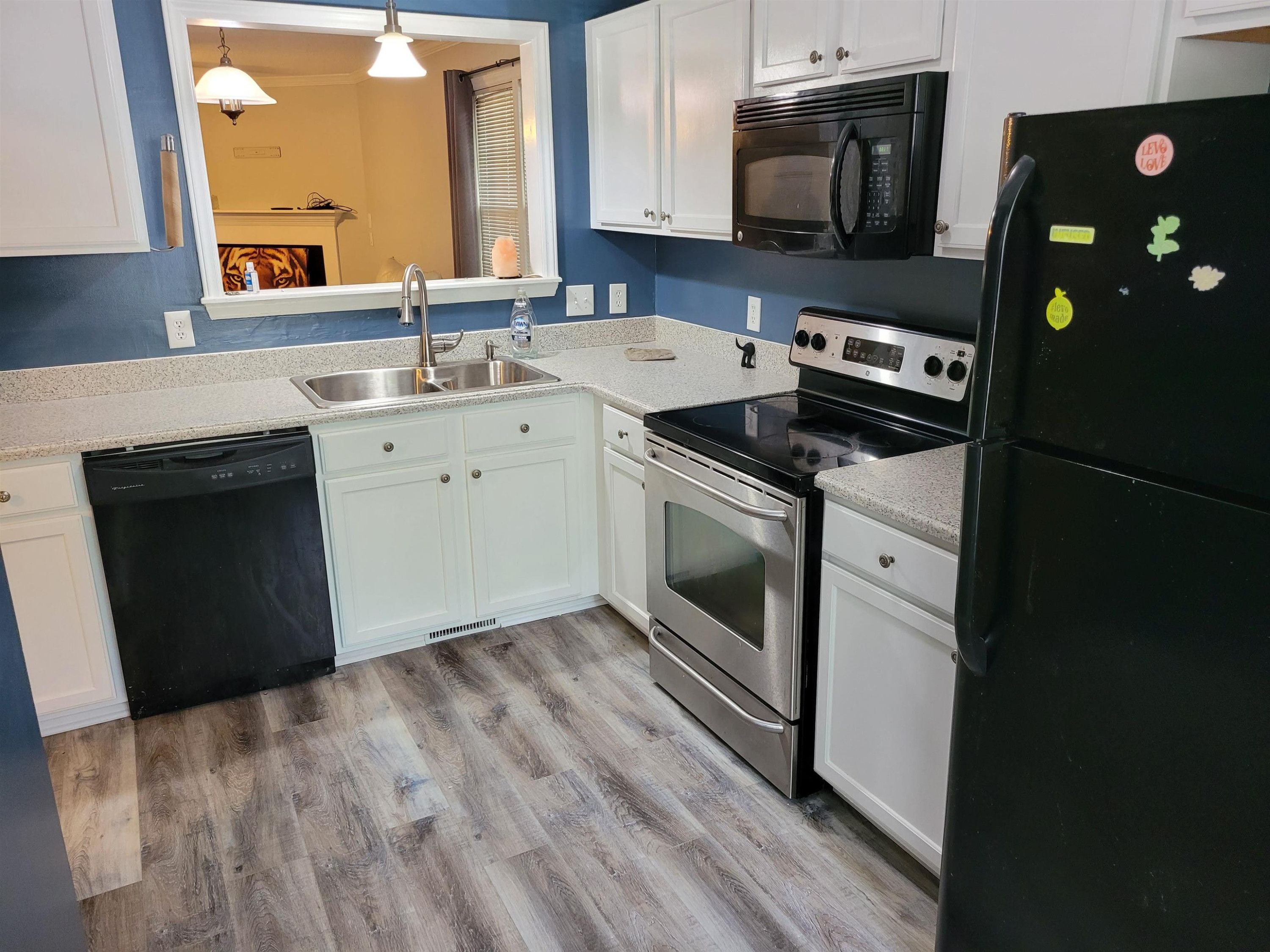 3809 Axle Lane Raleigh, NC 27616 - Photo 9 of 30 a kitchen with a sink stove and cabinets