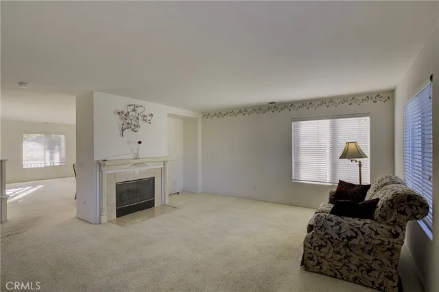 a bedroom with furniture and a fireplace