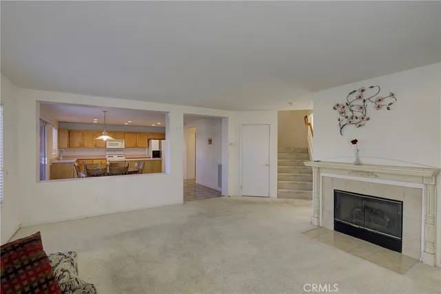 a view of an empty room with a fireplace