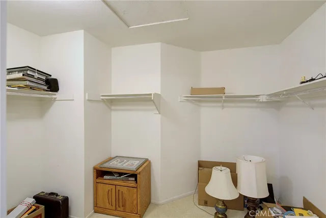 a view of a storage & utility room with cabinets