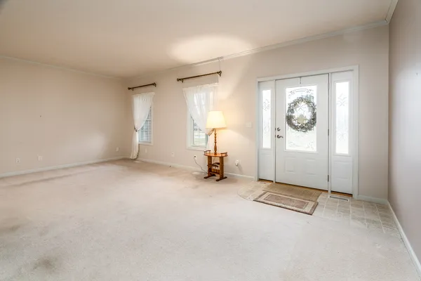 a view of a room with gym equipment and a window