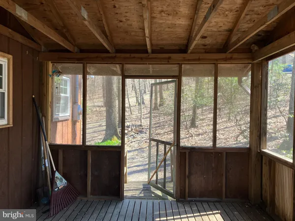 a view of a room with wooden floor
