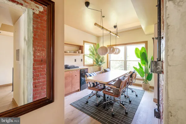a dining room with furniture and window