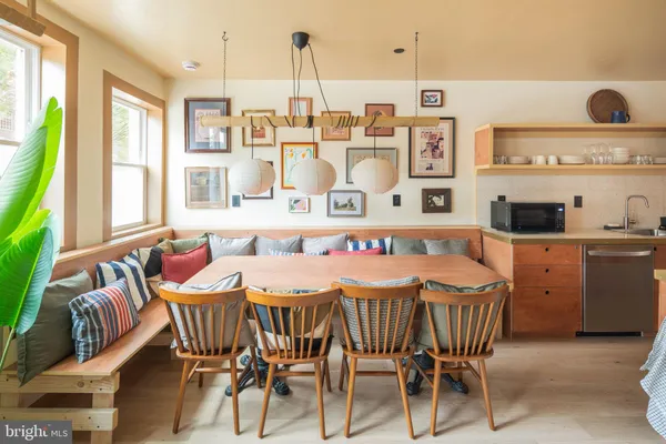 a dining room with furniture and window