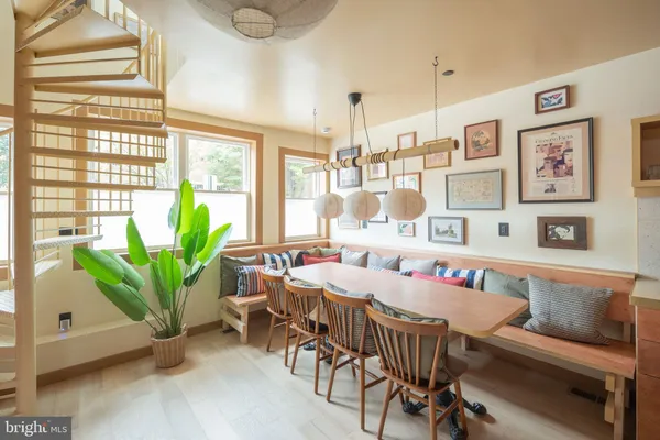 a view of a dining room with furniture window and outside view