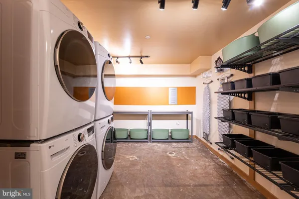 a view of a storage & utility room with washer and dryer