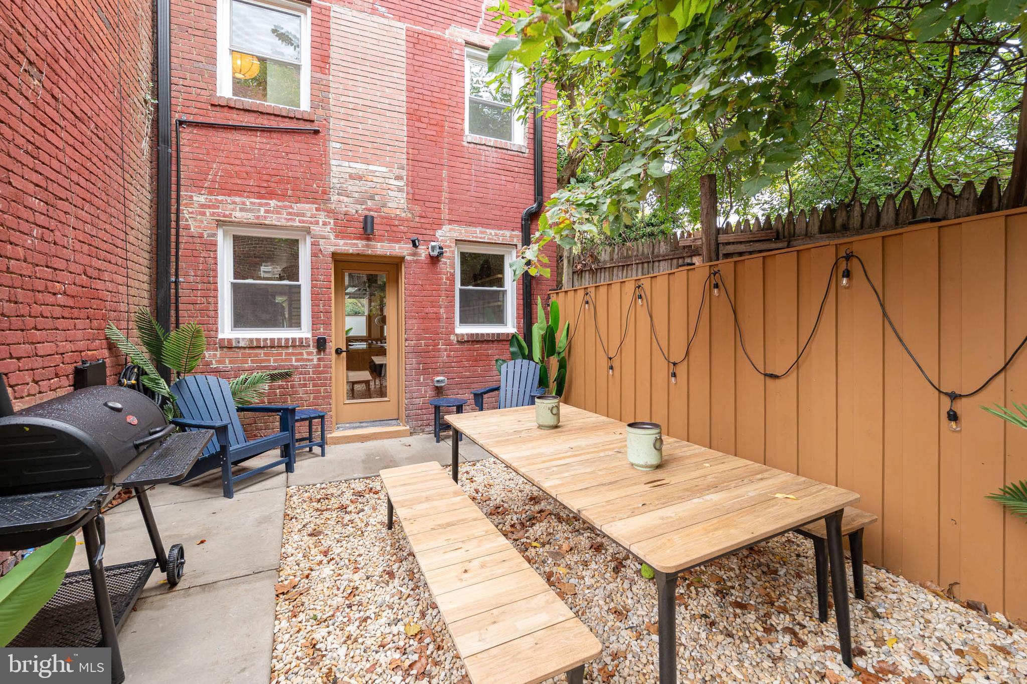 2021 4th Street Northwest Washington, DC 20001 - Photo 24 of 27 a view of a dinning table and chair in patio