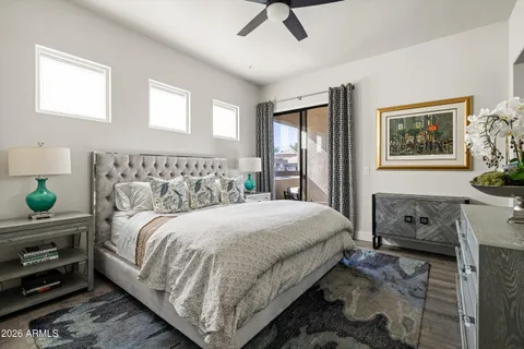 a bedroom with a bed and dresser