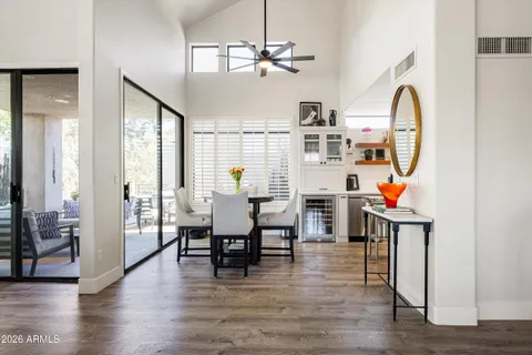a view of a dining room with furniture and wooden floor