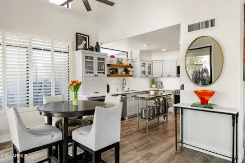 a kitchen with stainless steel appliances a stove a sink a microwave and cabinets