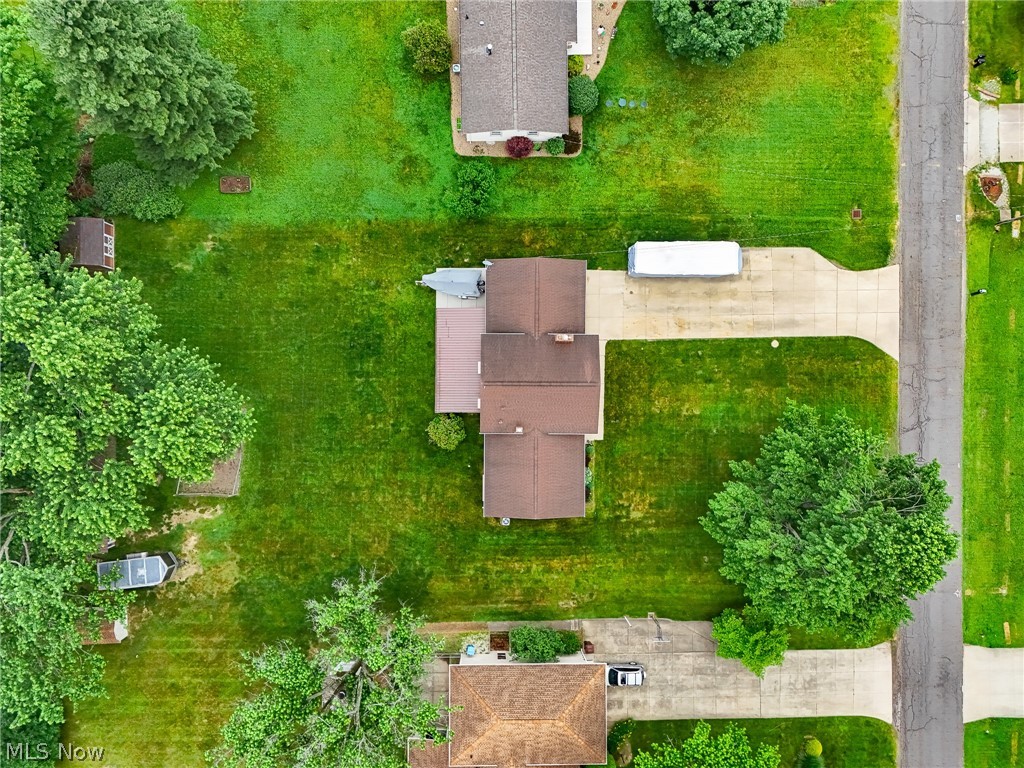 5862 Canterbury Road New Franklin, OH 44319 - Photo 2 of 45 Concrete rive, extra boat pad in rear, 2 sheds