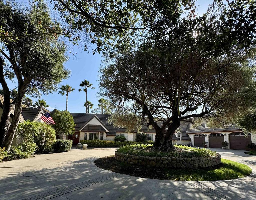 2848 Los Alisos Drive Fallbrook, CA 92028 - Photo 1 of 74 a front view of a house with a garden