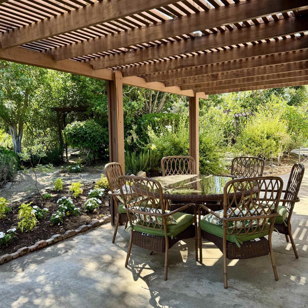 2848 Los Alisos Drive Fallbrook, CA 92028 - Photo 25 of 74 a view of a patio with table and chairs and potted plants
