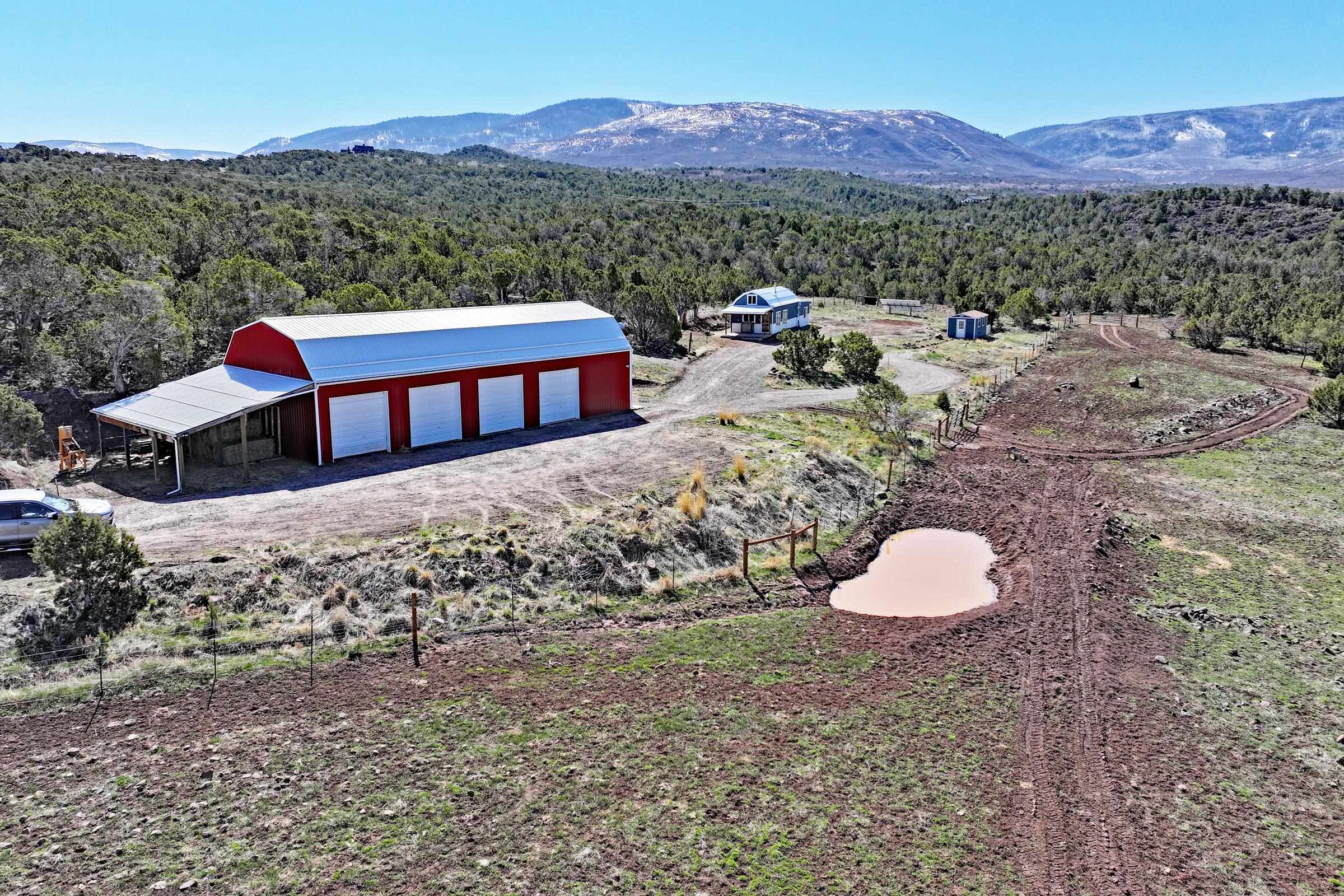 56001 KK Road Molina, CO 81646 - Photo 2 of 42 a view of a back yard with a table and chairs