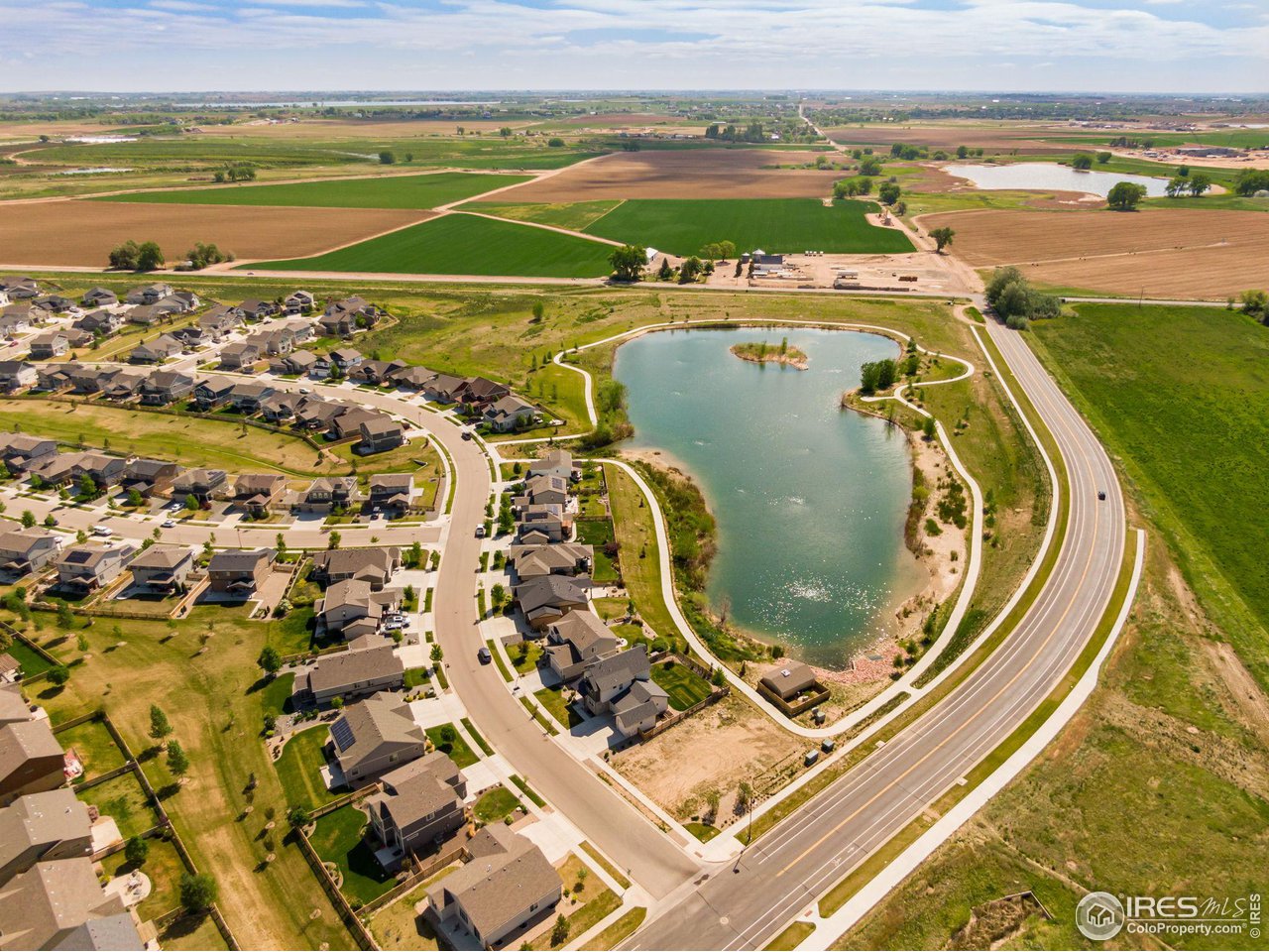 5536 Long Drive Timnath, CO 80547 - Photo 2 of 24 a view of a swimming pool with a ocean view