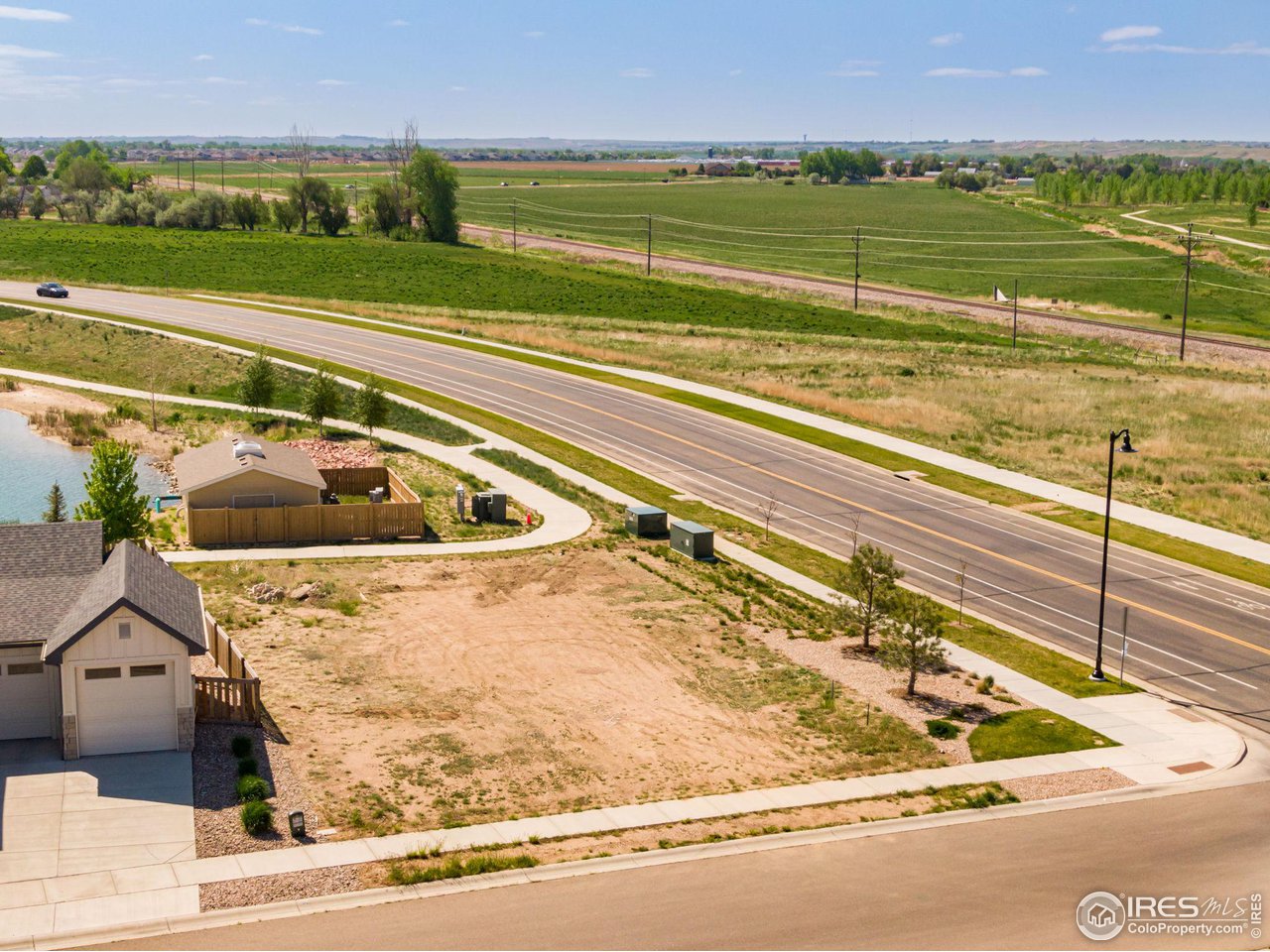 5536 Long Drive Timnath, CO 80547 - Photo 9 of 24 a view of a swimming pool and a yard