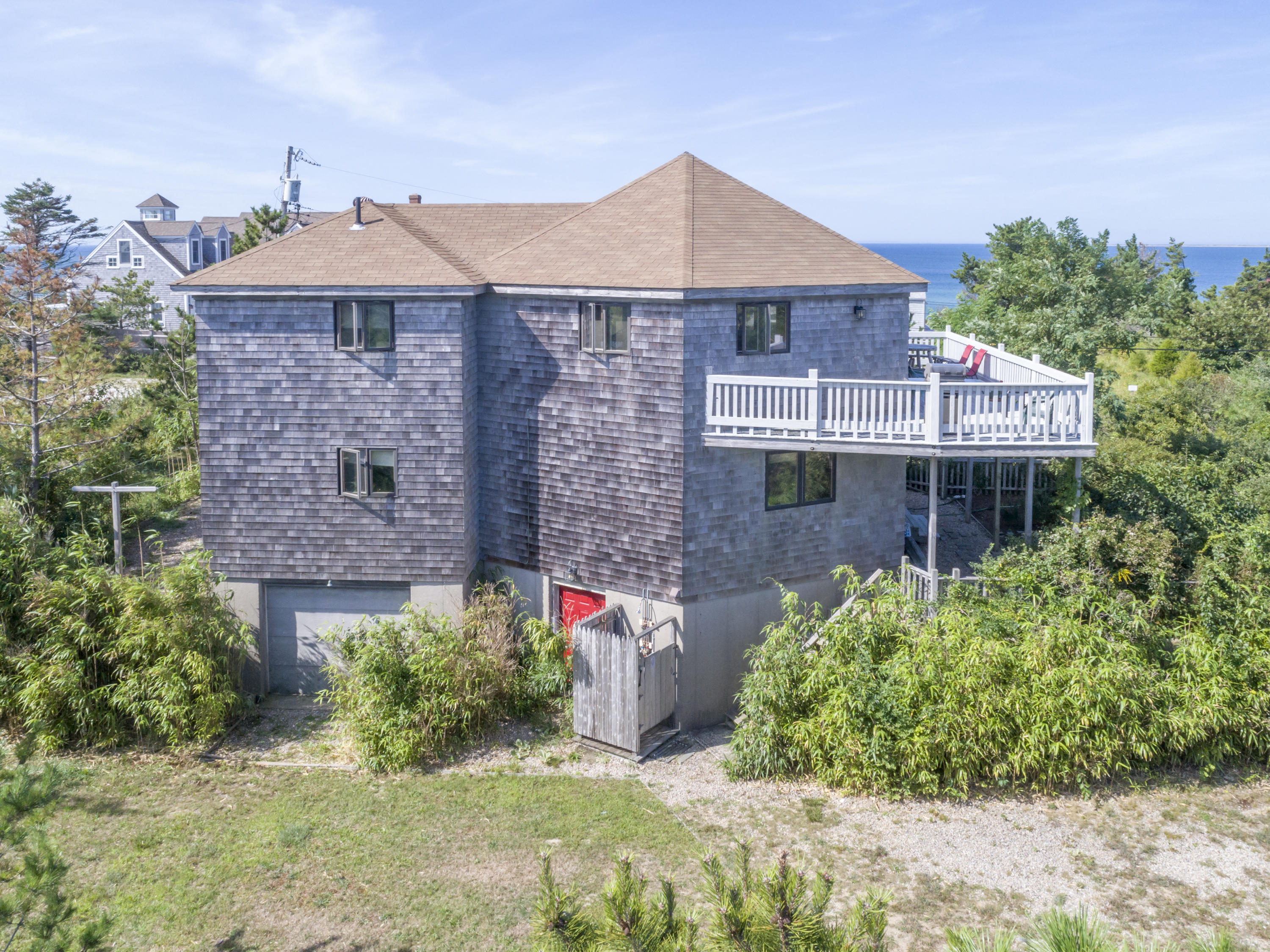 34 Bay View Road Truro, MA 02666 - Photo 3 of 14 a front view of a house with garden
