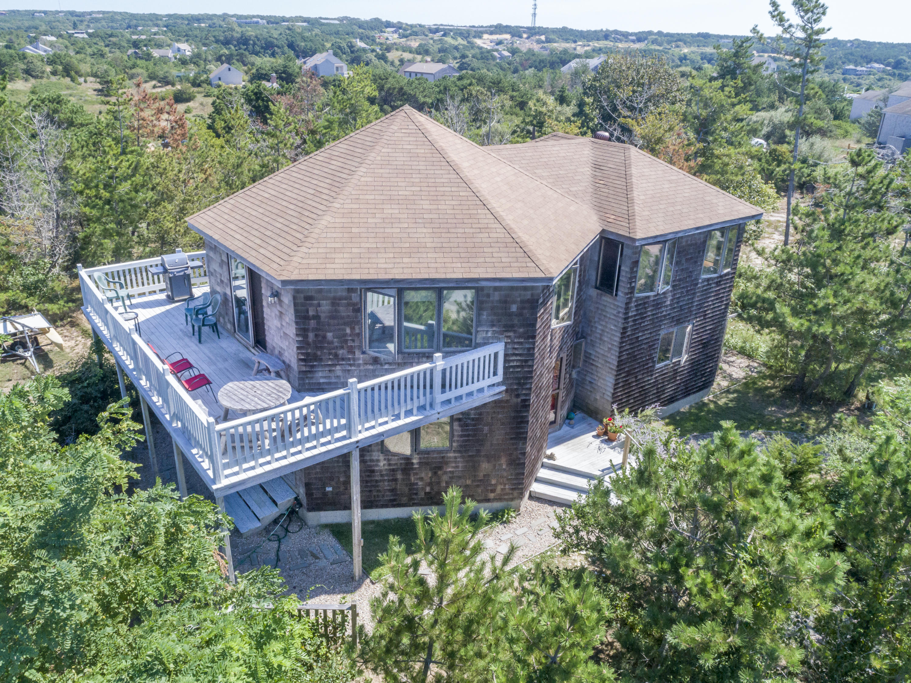 34 Bay View Road Truro, MA 02666 - Photo 6 of 14 an aerial view of a house with balcony and trees al around