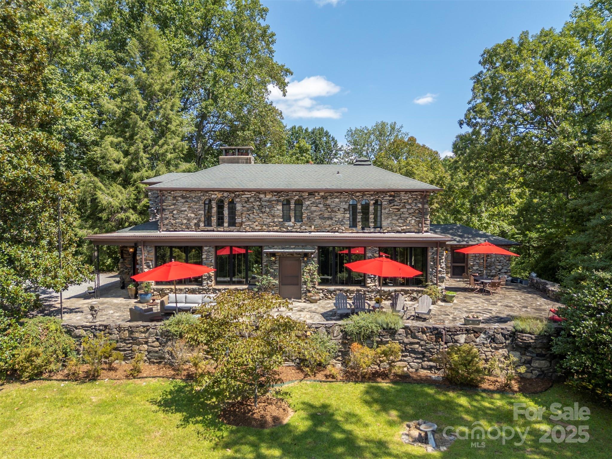 222 Stone Hedge Lane Tryon, NC 28782 - Photo 1 of 48 a view of a small house with swimming pool and sitting area