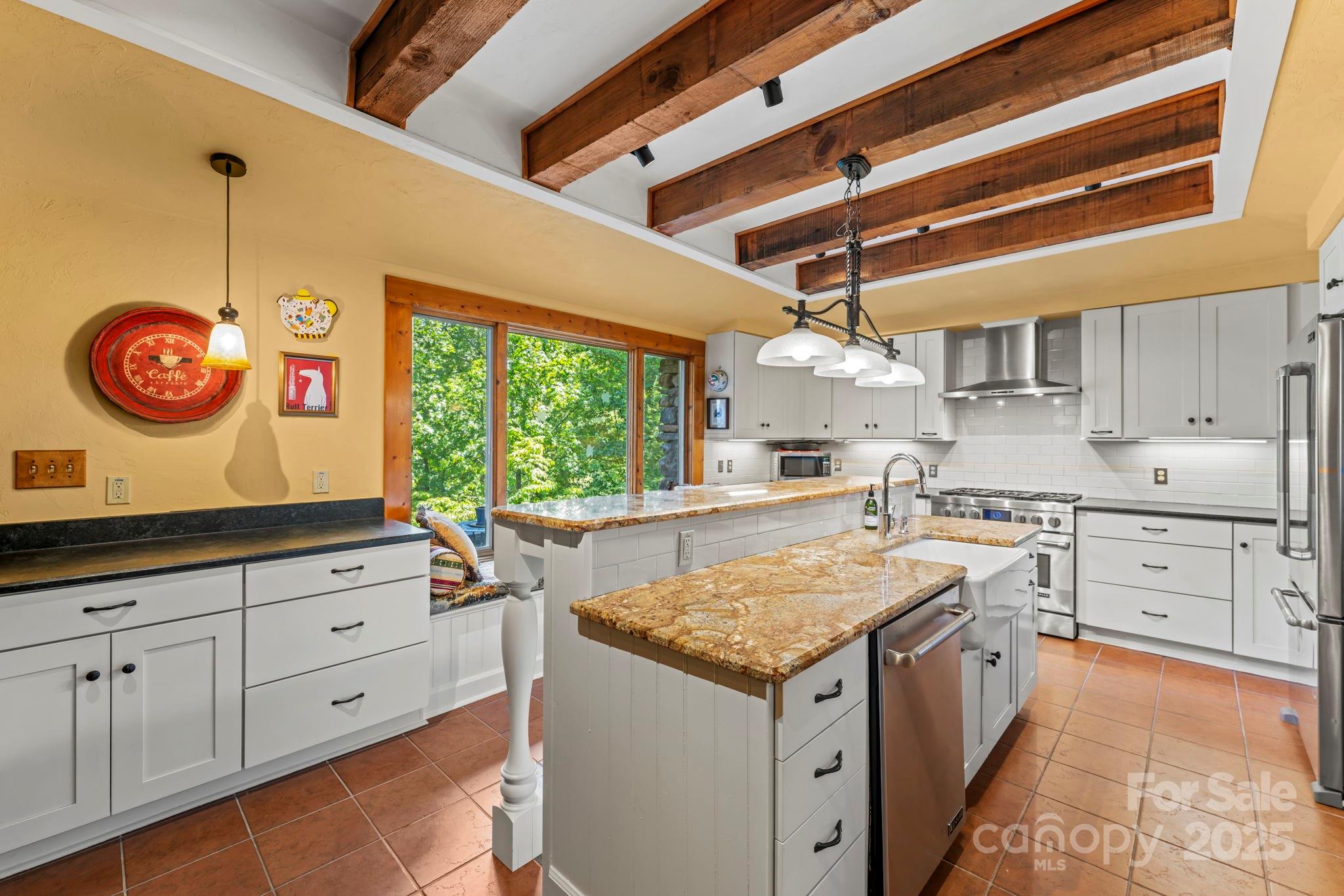222 Stone Hedge Lane Tryon, NC 28782 - Photo 11 of 48 a kitchen that has a lot of cabinets in it