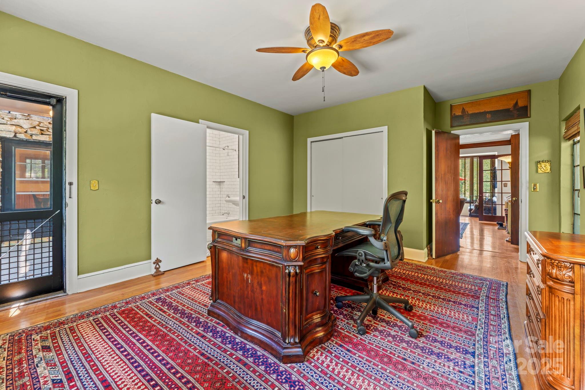 222 Stone Hedge Lane Tryon, NC 28782 - Photo 17 of 48 a view of a workspace with furniture and wooden floor