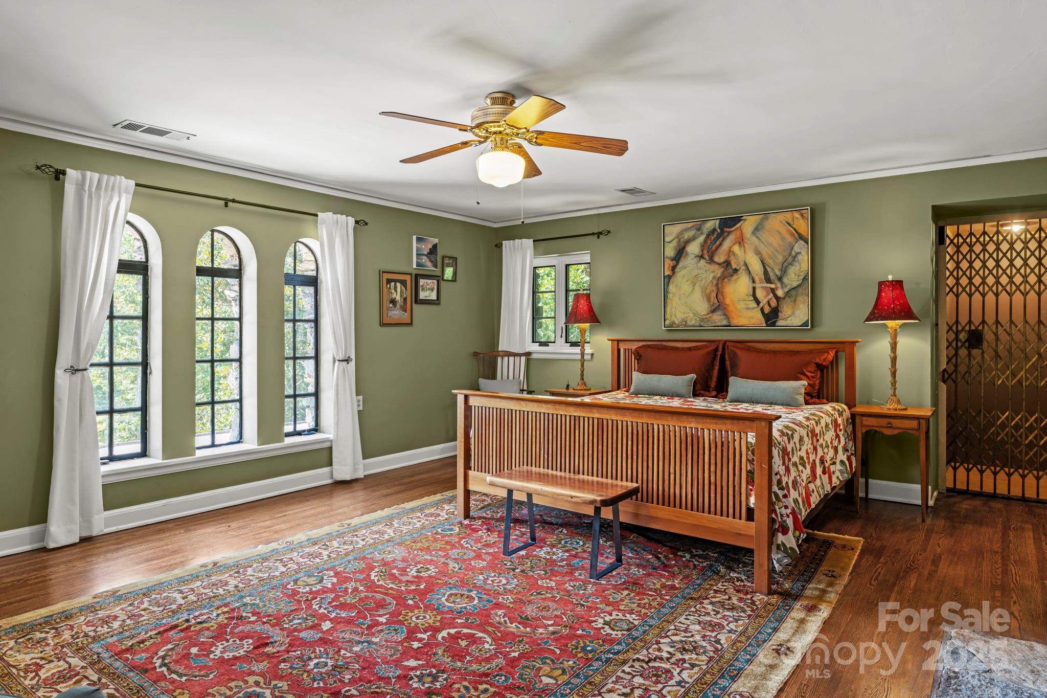 222 Stone Hedge Lane Tryon, NC 28782 - Photo 20 of 48 a bedroom with a bed and a window