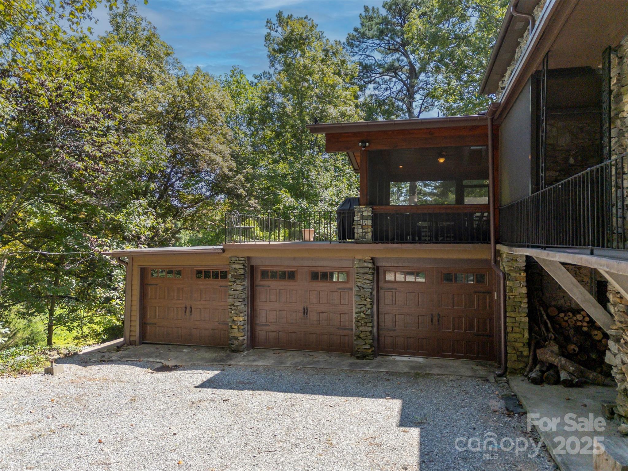 222 Stone Hedge Lane Tryon, NC 28782 - Photo 34 of 48 a view of a house with a garage