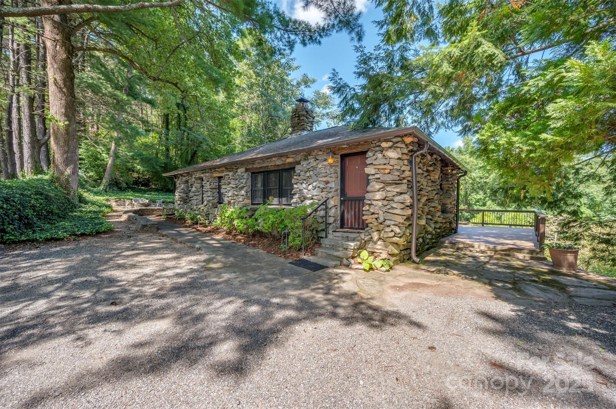 222 Stone Hedge Lane Tryon, NC 28782 - Photo 35 of 48 a view of a house with a yard and large trees