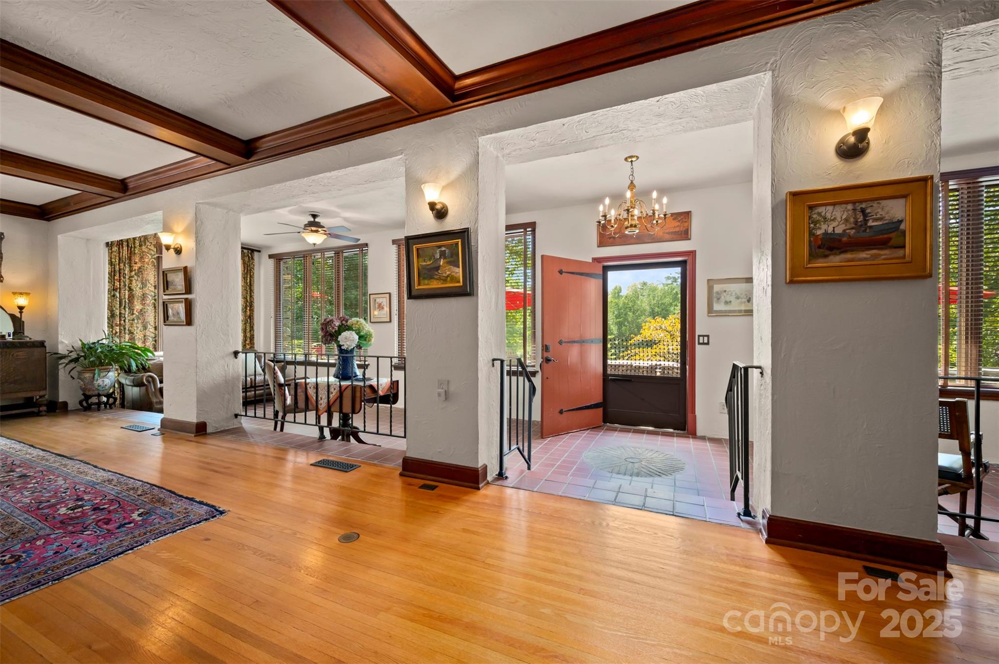 222 Stone Hedge Lane Tryon, NC 28782 - Photo 9 of 48 a view of a lobby with furniture and floor to ceiling window