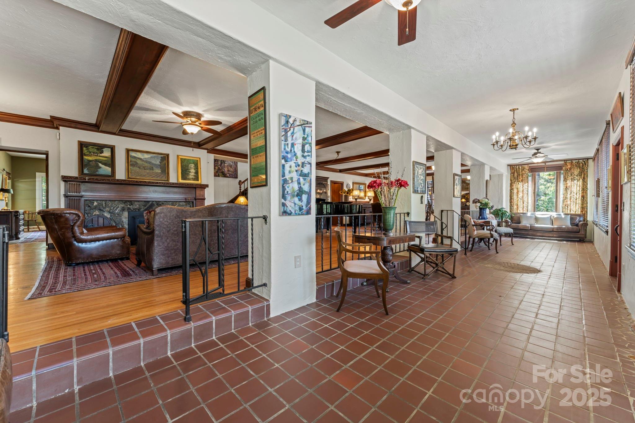 222 Stone Hedge Lane Tryon, NC 28782 - Photo 10 of 48 a living room filled with furniture and a table