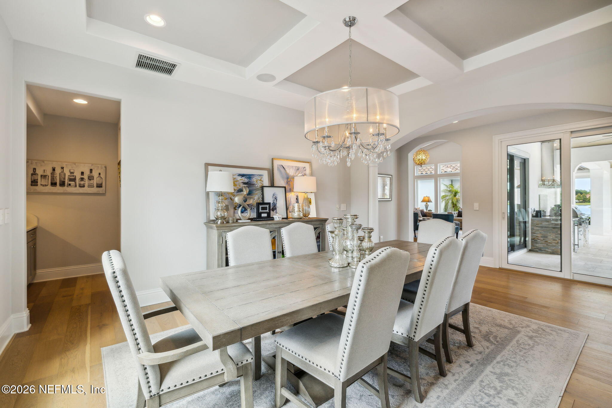 5275 Bentpine Cove Road Jacksonville, FL 32224 - Photo 12 of 95 a view of a dining room with furniture and chandelier