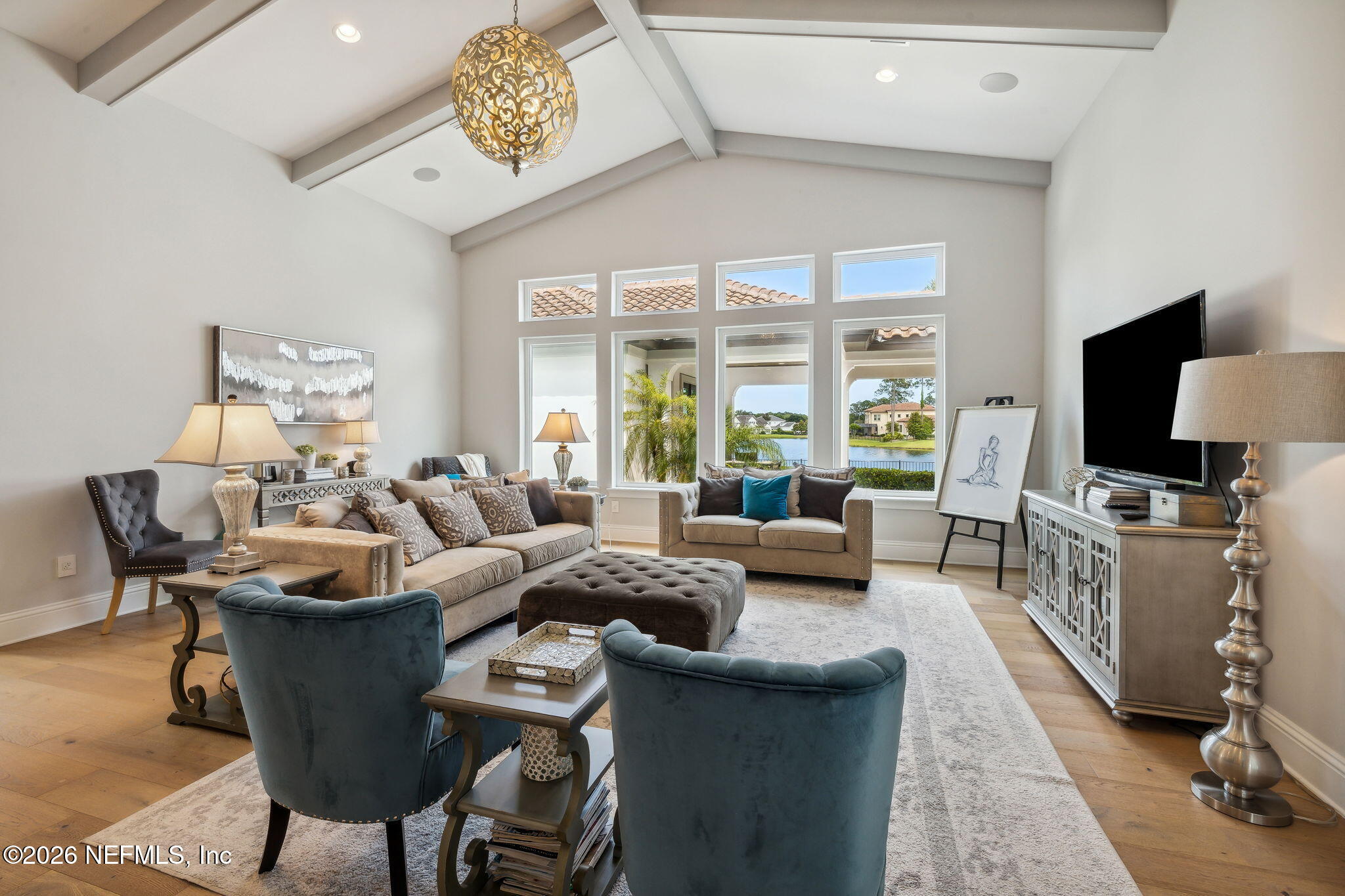 5275 Bentpine Cove Road Jacksonville, FL 32224 - Photo 16 of 95 a living room with furniture and a flat screen tv