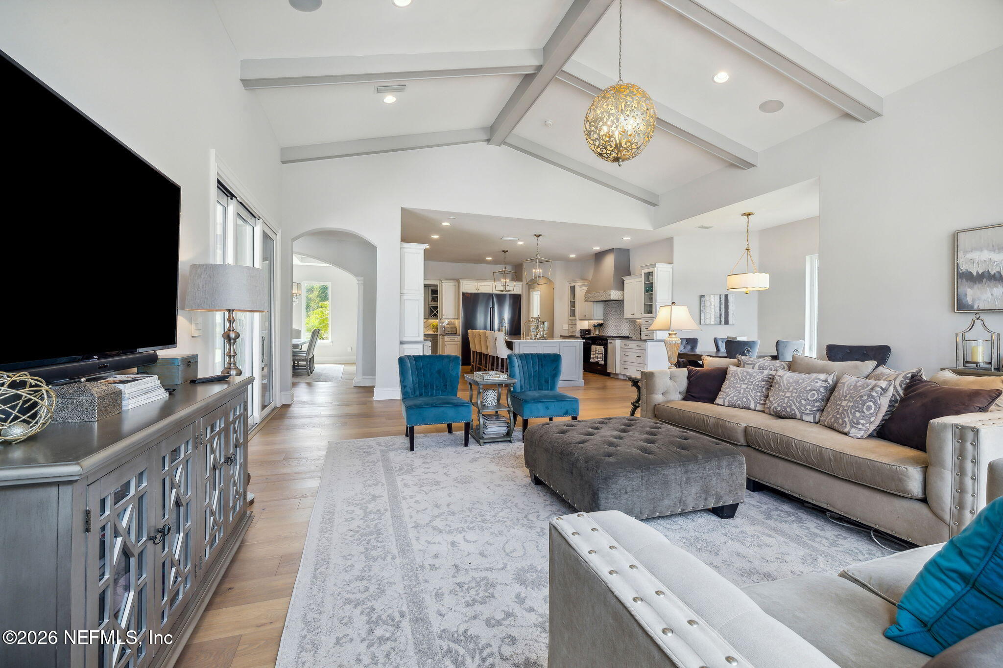 5275 Bentpine Cove Road Jacksonville, FL 32224 - Photo 18 of 95 a living room with furniture and a flat screen tv
