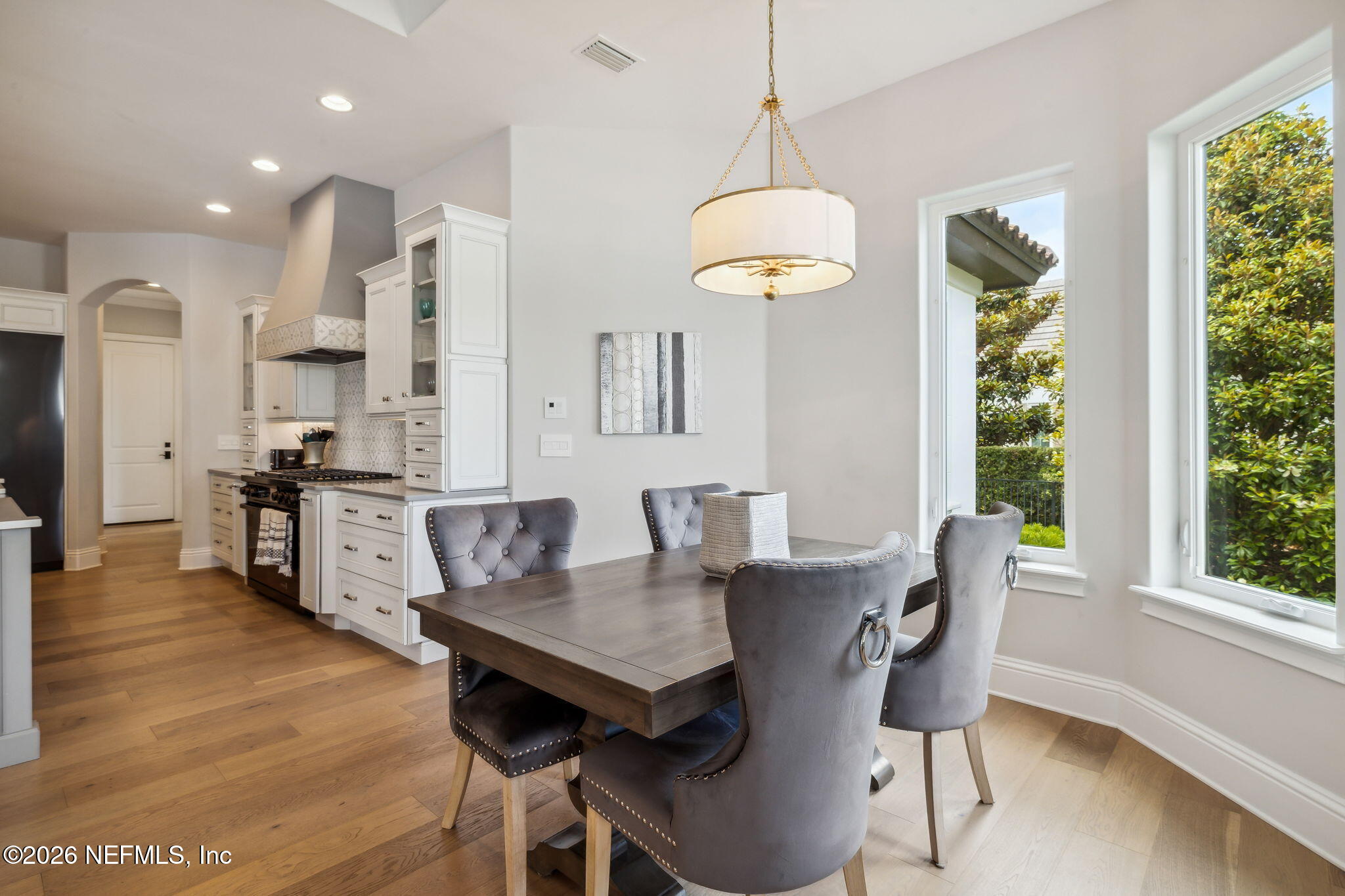 5275 Bentpine Cove Road Jacksonville, FL 32224 - Photo 27 of 95 a view of a dining room with furniture window and wooden floor