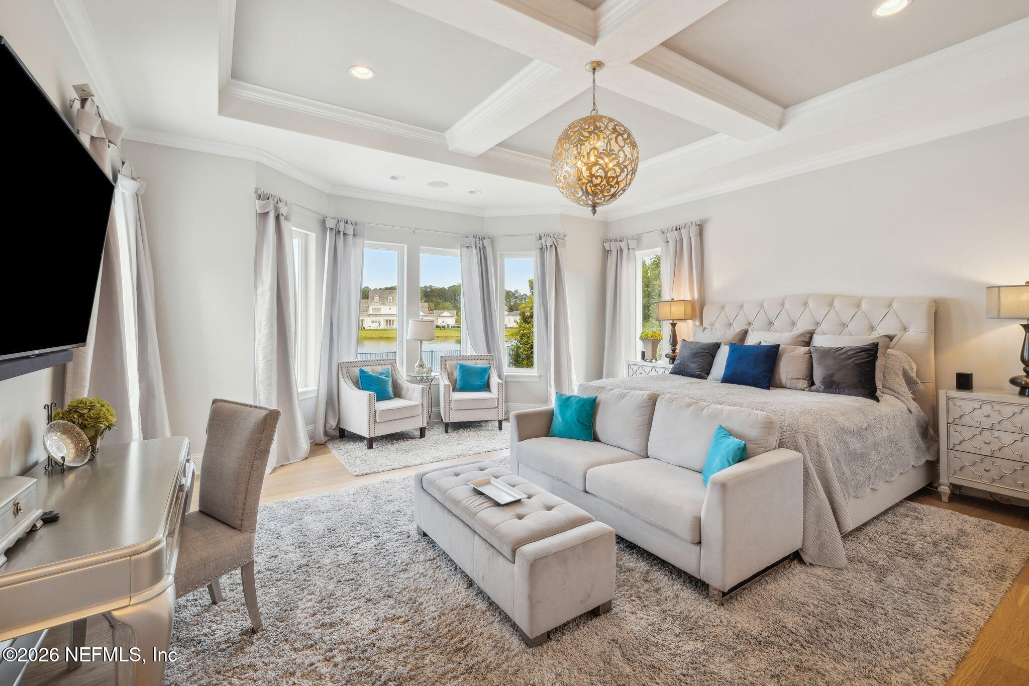 5275 Bentpine Cove Road Jacksonville, FL 32224 - Photo 30 of 95 a living room with furniture a flat screen tv and a large window