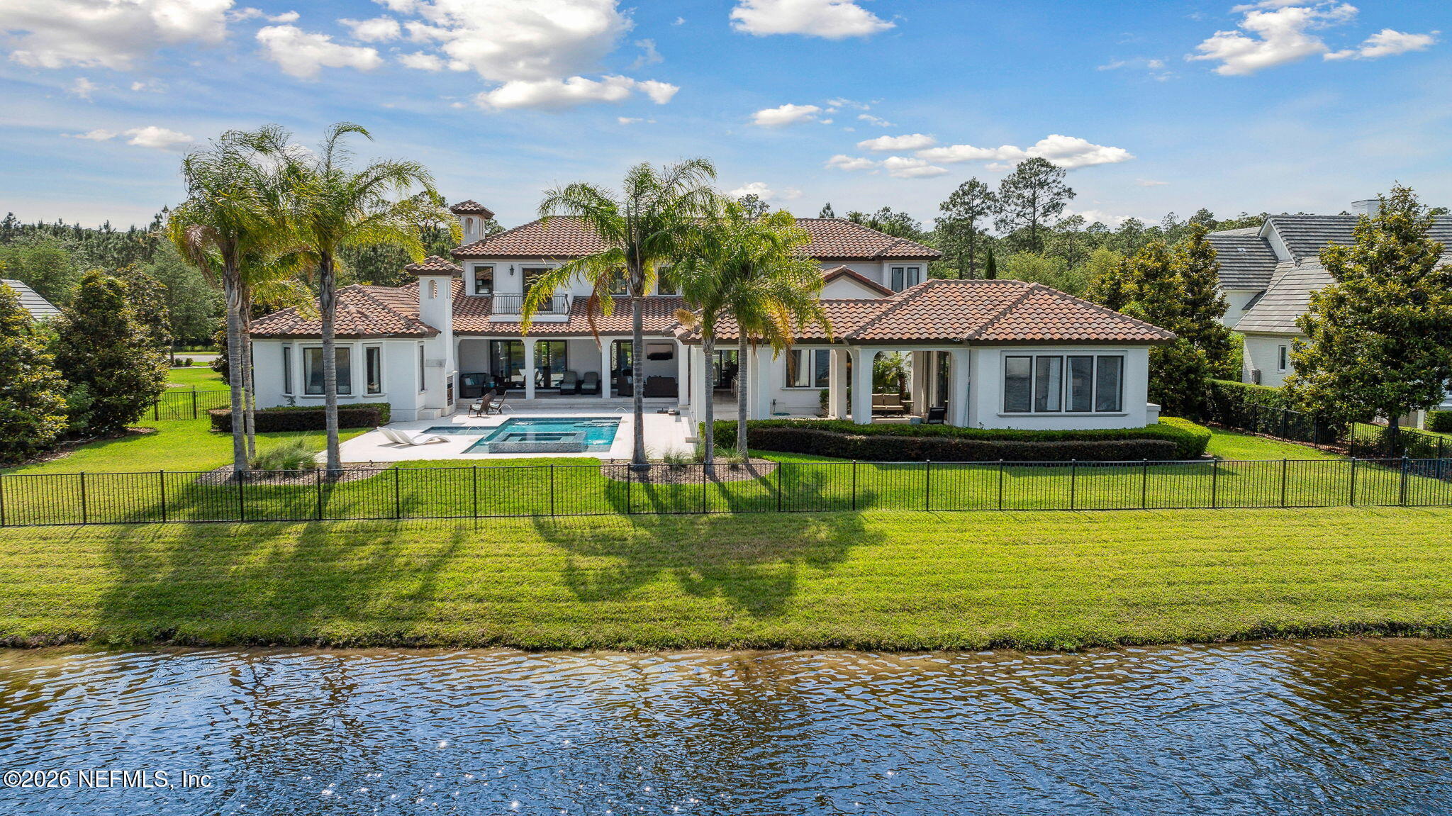 5275 Bentpine Cove Road Jacksonville, FL 32224 - Photo 3 of 95 a view of a swimming pool with a garden and plants