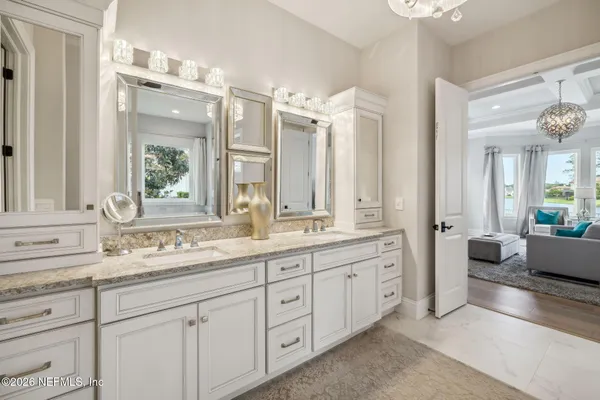 a bed room with a bed and a chair