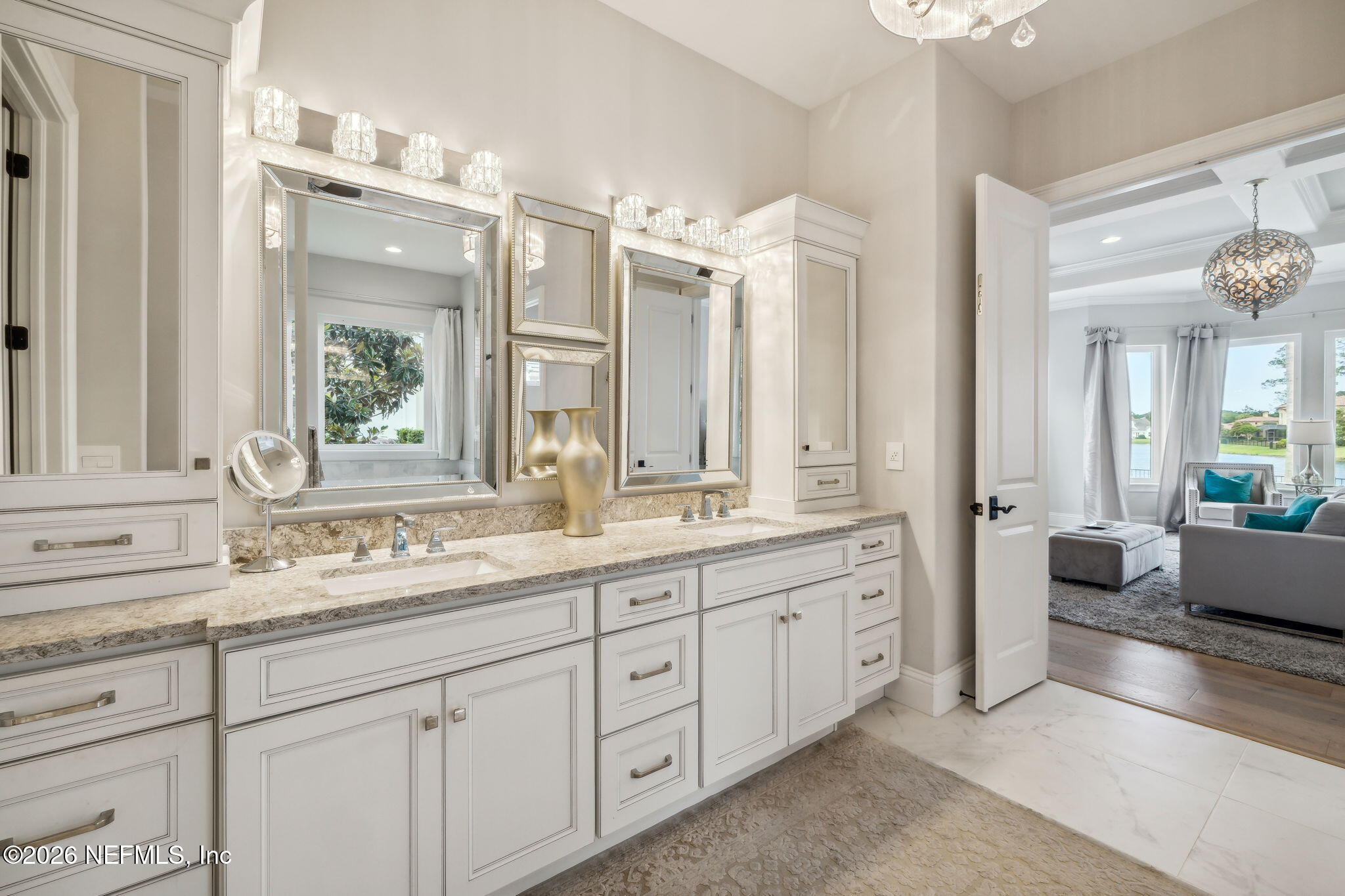 5275 Bentpine Cove Road Jacksonville, FL 32224 - Photo 33 of 95 a bathroom with double sink and a large mirror