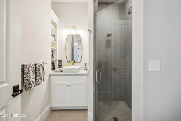 a front view of a house with swimming pool and porch