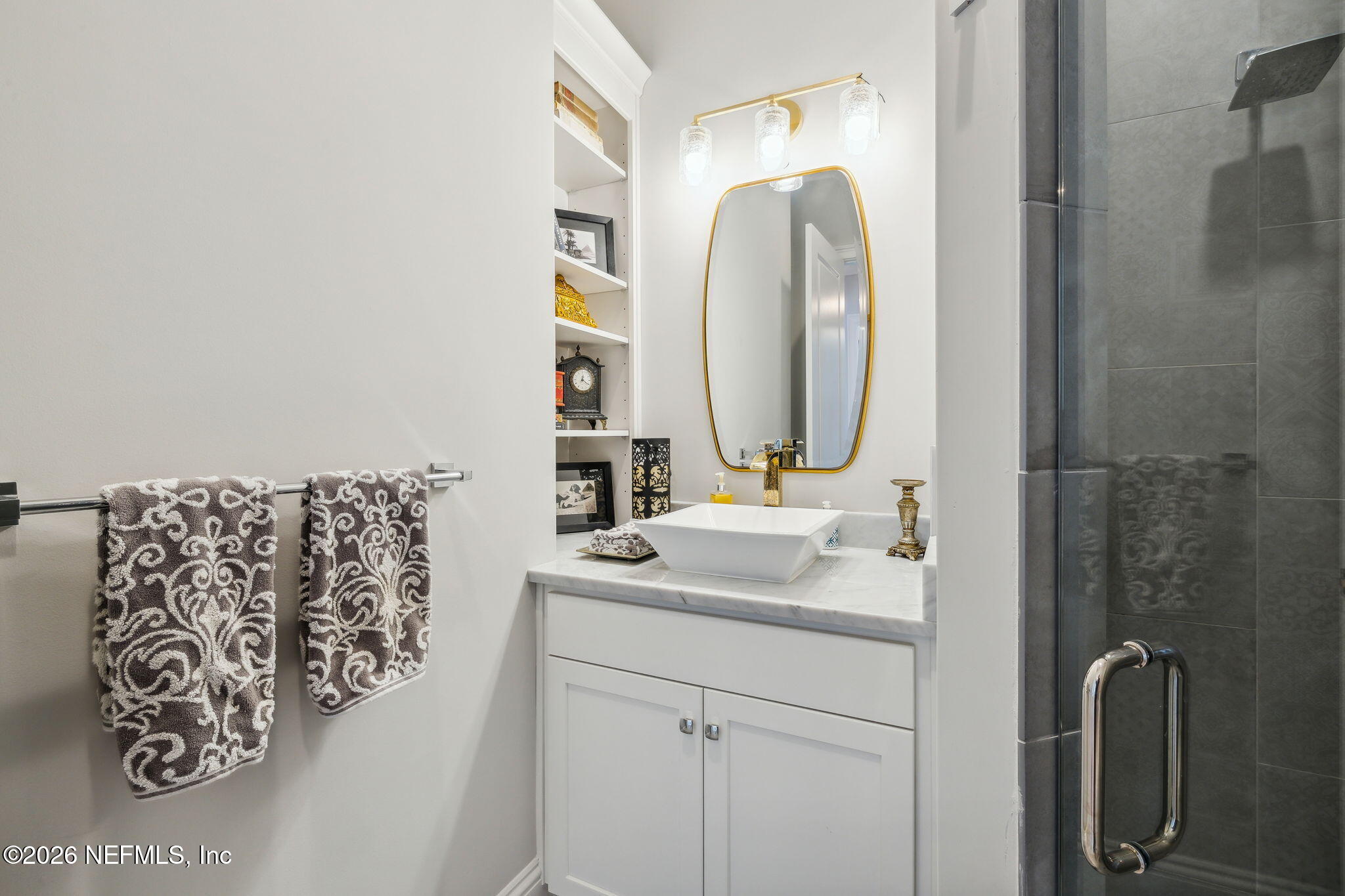 5275 Bentpine Cove Road Jacksonville, FL 32224 - Photo 41 of 95 a bathroom with a sink vanity and a mirror