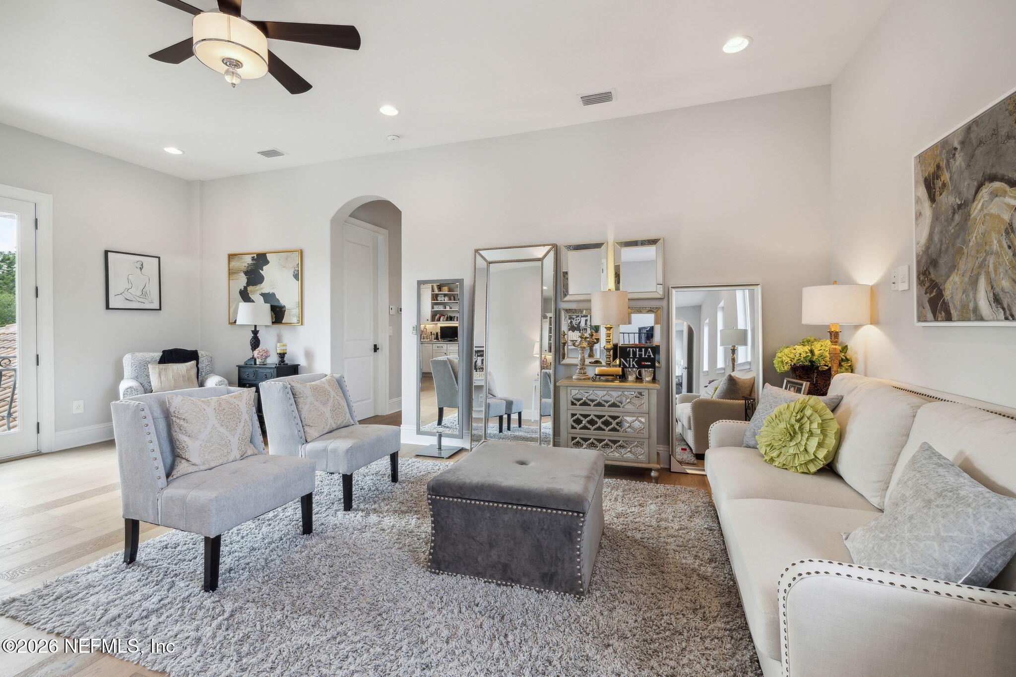 5275 Bentpine Cove Road Jacksonville, FL 32224 - Photo 46 of 95 a living room with furniture and a chandelier