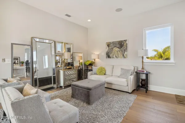 a view of a lake with a house in the background